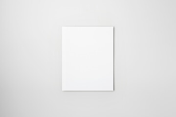Fototapeta premium Single vertical blank paper mockup template. Flat lay on a neutral grey background. 
