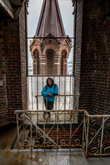 woman tourist in a blue jacket admires the sights of old Kazan