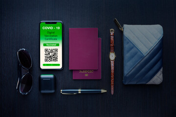 Still life Covid passport, wristwatch, wallet and sunglasses