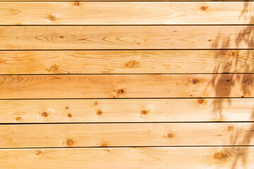 Fresh wood softwood wall made of horizontal boards.