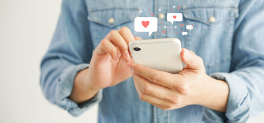 close up young man holding smartphone to chat message with online people in  dating website application to make appointments to flirting for lifestyle people concept