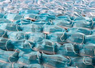 Fototapeta premium Bunch of surgical masks on flat surface