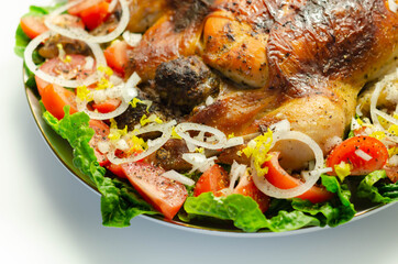 Roasted British large chicken with classic pork, sage, and onion stuffing served with little gem lettuce, tomato, and  fresh onion