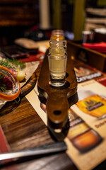 still life with food and glasses on a table in a restaurant 
