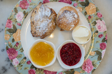 Scones with jam and clotted cream.
