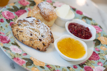 Scones with jam and clotted cream.