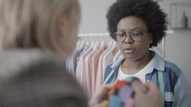 Tailor listening to upset customer, feeling tired of difficult clients, conflict