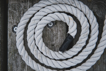 A perfect circle of white old rope. Sailing and Maritime concept.