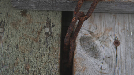 Moody Rusty Brown Old chain in the harbor.