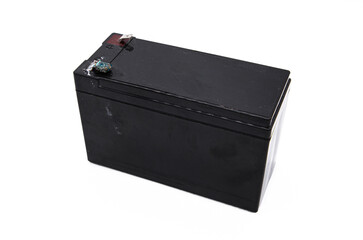 Black electric battery on white background