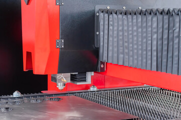 Automatic cnc laser cutting machine working with sheet metal at factory, plant. Metalworking, machining, industrial, equipment, technology, manufacturing concept