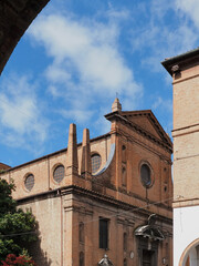 Ferrara, Italy. Upper part of the facade of the San Paolo church seen from the arches of the opposite building.