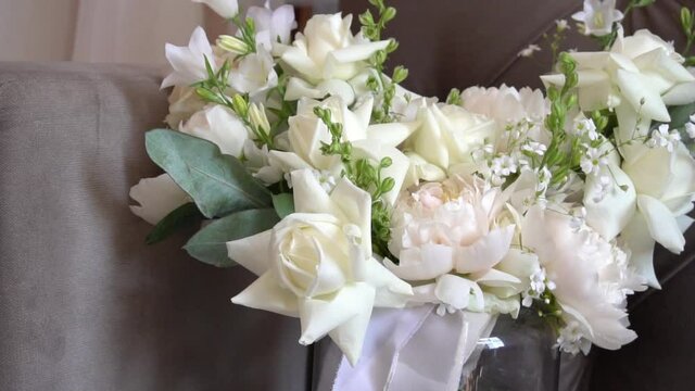 Closeup Shot Of Wedding Details - Shoes And Bouquet. Wedding Bouquet Slow Motion