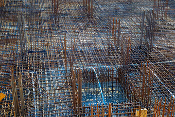 Billets of reinforcement at the construction site. New construction. Reinforced concrete construction.