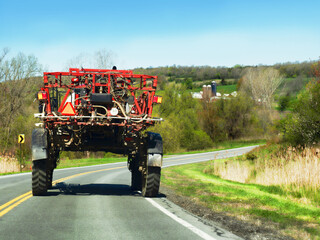 Farm machinery on a country road - 433312447