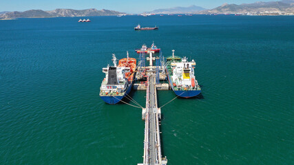 Aerial drone photo of crude oil tankers anchored in Mediterranean industrial port
