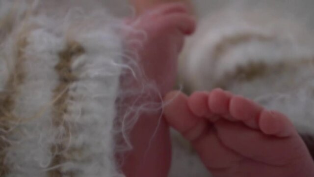 Tiny Newborn Baby's feet closeup. Beautiful conceptual image of Maternity