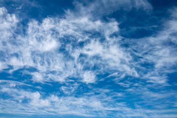 beautiful blue sky with white cirrus clouds as a natural background - obrazy, fototapety, plakaty