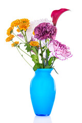 Beautiful spring bouquet with carnation flowers and chrysanthemums in blue vase isolated on white background