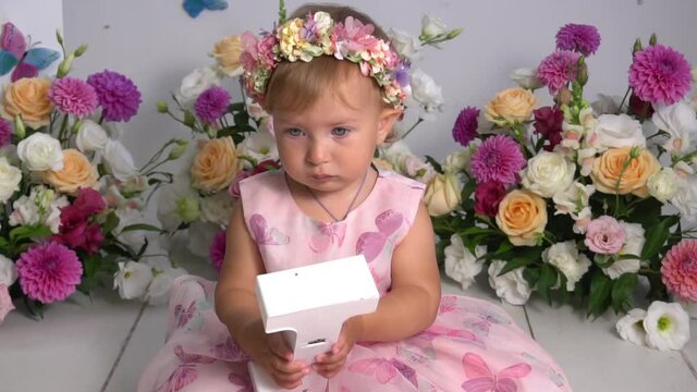 Slow Motion Portrait of cute adorable baby girl celebrating first birthday