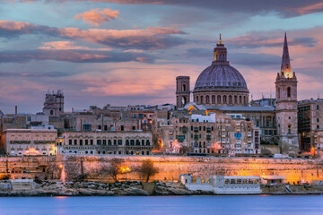 Obraz na płótnie Canvas lluminated cityscape of Valletta,Malta at Dramatic Sunset