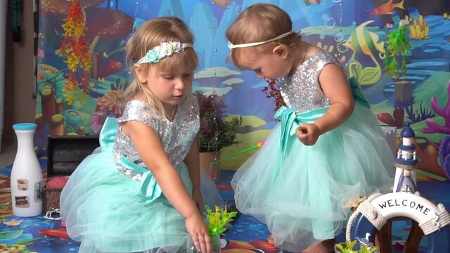 Slow Motion Two cute girls playing, marine decoration