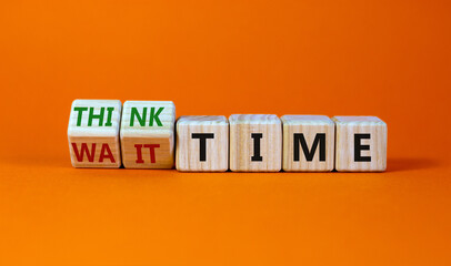 Think or wait time symbol. Turned wooden cubes and changed words 'wait time' to 'think time'. Beautiful orange background, copy space. Business and think or wait time concept.