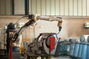 Robotic arm welding inox boiler with argon gas, automated industry process, machine welding