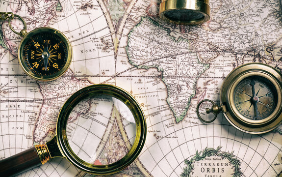Vintage style navigational objects on an old world map