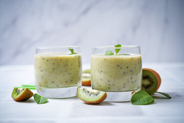 Kiwi banana smoothie in a glass
