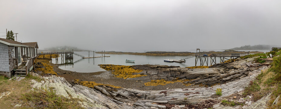 Harpswell village with beach and harbor in fog