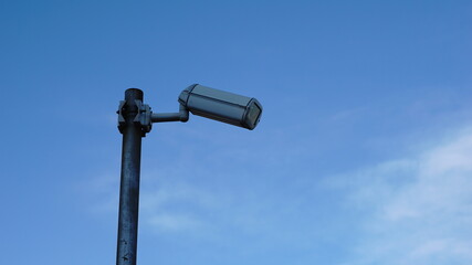 security camera against sky background
