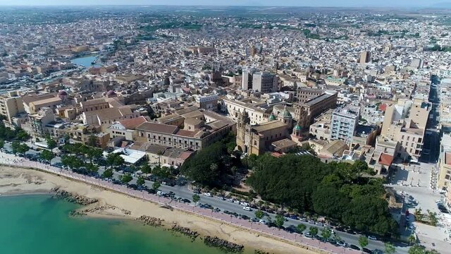 aerial top view with drone of the cathedral of SS Salvatore in Mazara del Vallo, Province of Trapani, Sicily overlooking the Mediterranean sea