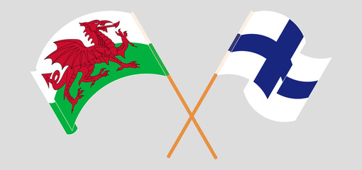 Crossed and waving flags of Wales and Finland