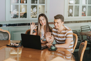 Young couple having conference call with laptop