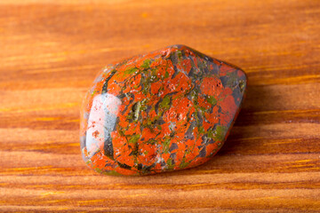Unakite stone on timbered table