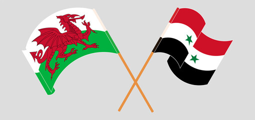 Crossed and waving flags of Wales and Syria