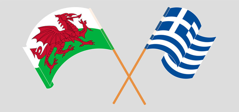Crossed and waving flags of Wales and Greece