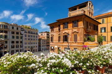 Piazza di Spagna Trinit dei Monti panorama of the stately buildings the street lamps in the famous square of Rome in spring with an explosion of white and pink azaleas that color the baroque staircase