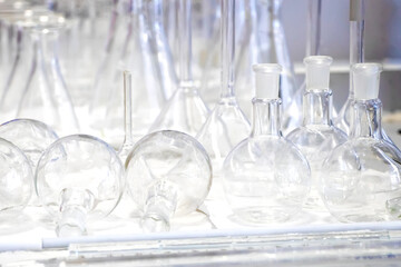 Different laboratory glassware equipmets in chemistry lab. baker, erlenmayer, reaction flask on...