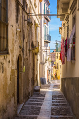 Fototapeta na wymiar Beautiful alley descending to the sea, Rodi Garganico, Gargano, Italy