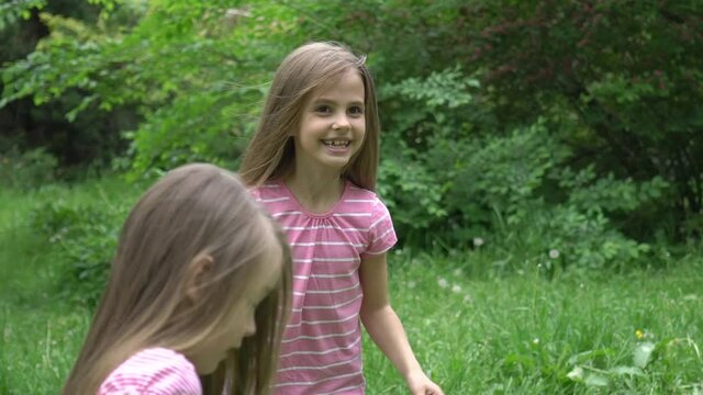 Slow Motion Dancing and be happy. Little girls together in nature.