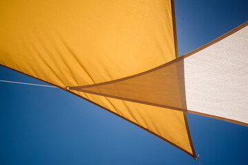 Fototapeta na wymiar blue sky and textile awning for the sun 