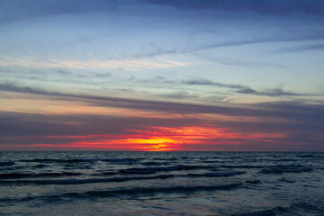 Fototapeta premium Warm Sunset On The Gulf of Mexico with Tourist Parachute Parasailing at Stickney Point at Crescent Beach Siesta Keys Florida