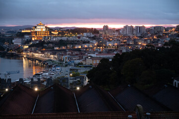 Panoramic view on Douro river and old part of Porto city in Portugal at night