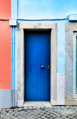 Old and colorful wooden door with iron details