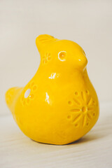 Yellow figurine made of clay, whistle toy bird - 433340841
