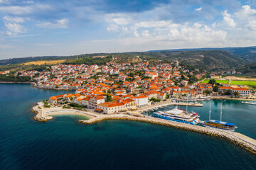 Fototapeta na wymiar Aerial panoramic drone view on village Postira on Brac island, Croatia. August 2020