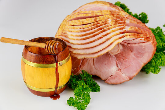 Sliced Hickory Smoked Ham With Honey In Jar.