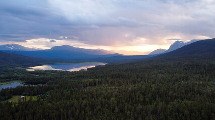 Fototapeta na wymiar Drone view of the forests and mountains of Kvikkjokk, Swedish Lapland.